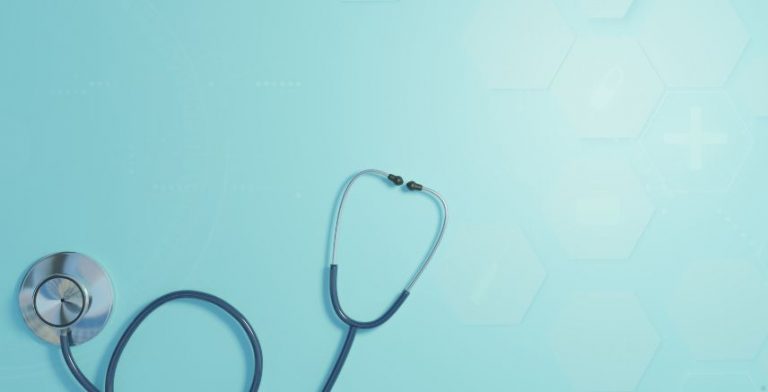 A dark blue stethoscope on a light blue background.