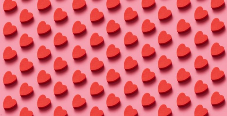 A digital drawing of red hearts on a pink background.