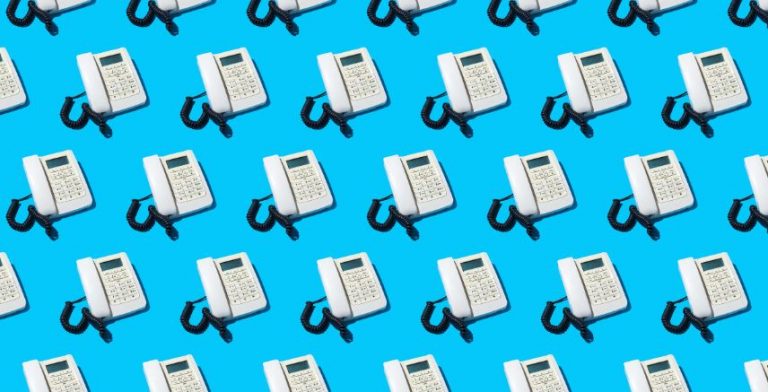 Images of a white caption phone repeated on a blue background.