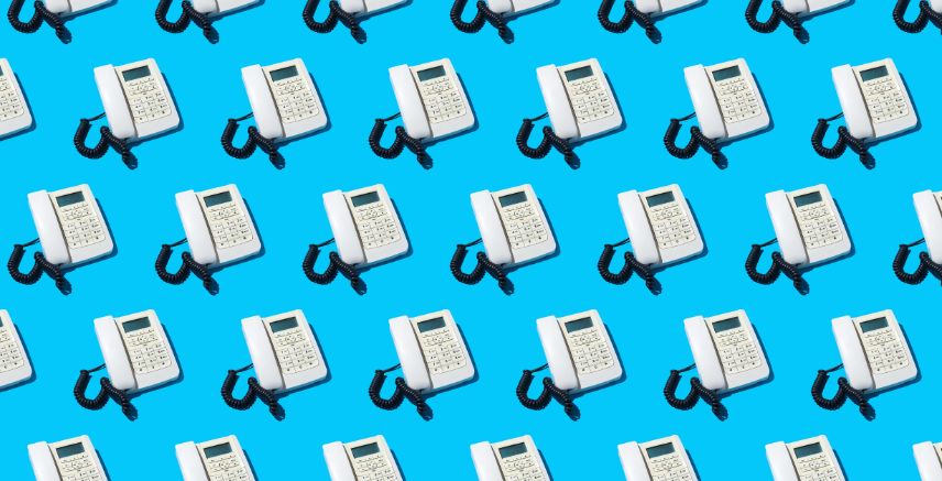 Images of a white caption phone repeated on a blue background.